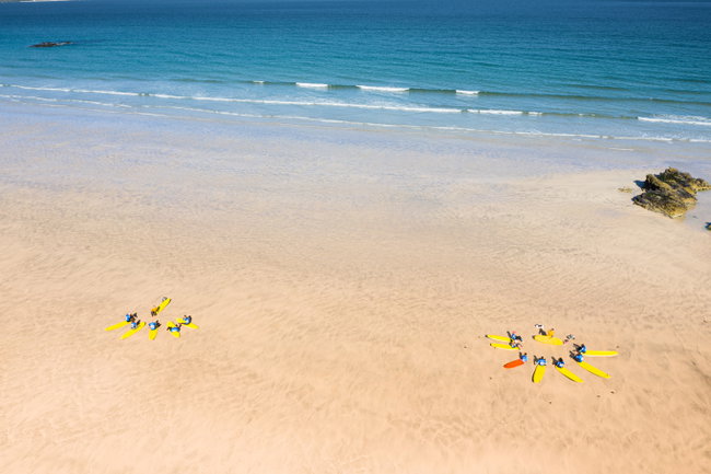 Global Boarders Hit the Surf 2 Surf Lessons